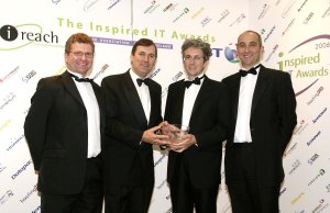 Nick Breen, Tom Kitt presenting the award to Paul Barry, and John Cremmins